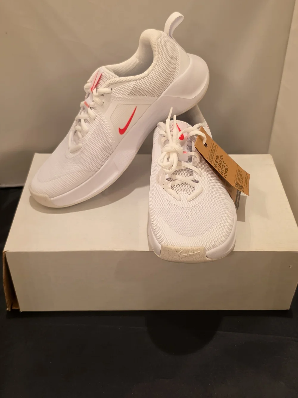 Nike Women's White Athletic Sneakers with Pink Swoosh